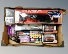 A quantity of boxed and unboxed die cast vehicles to include Exclusive First Editions,