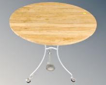 A circular wooden slatted bistro table on metal base.