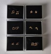 Six pairs of gold plated earrings, all in boxes.