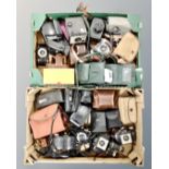 Two boxes containing vintage cameras, Hitachi video camera, camera cases.