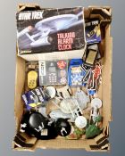 A box of Star Trek collectables to include a Wasco talking alarm clock, vehicles on stands,