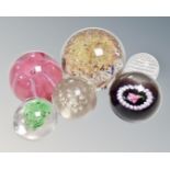 Assorted glass paperweights, glass golf ball, glass globe, Kosta glass,