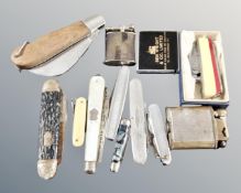 A collection of assorted pocket lighters and penknives to include mother of pearl silver fruit