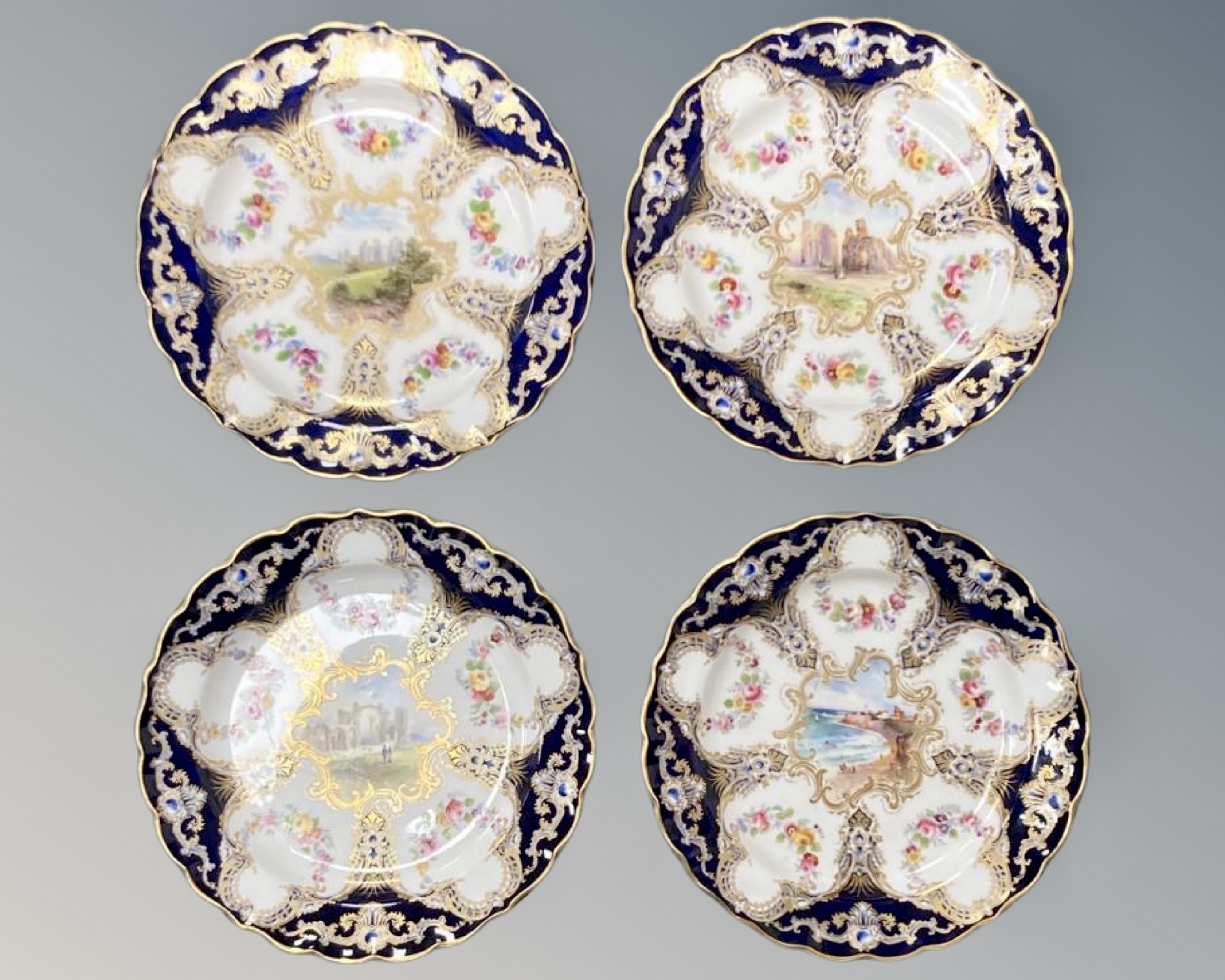 Four Royal Worcester hand painted and gilded cabinet plates,