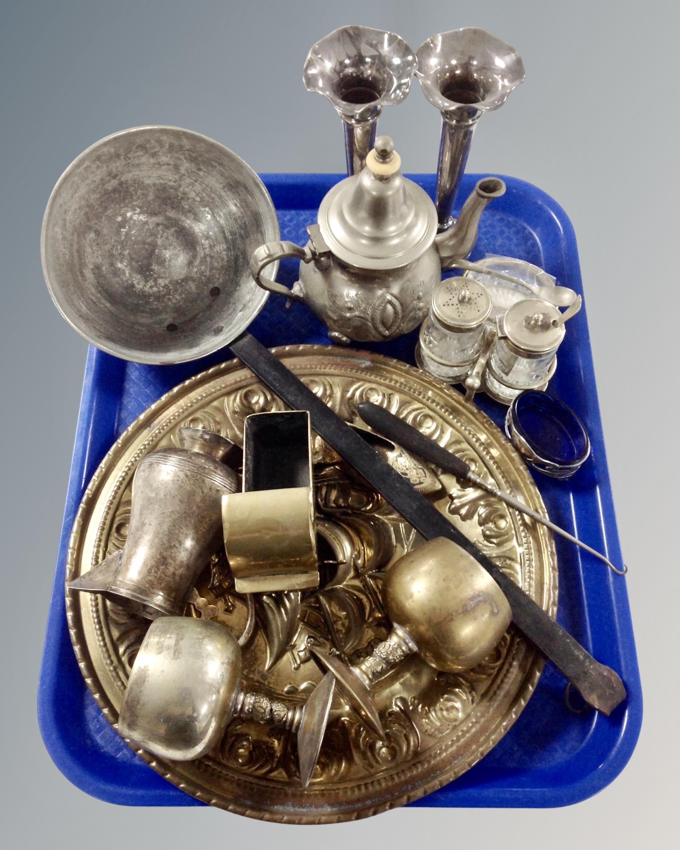 A tray containing antique and later metal wares including cast iron handled ladle, brass plaque,