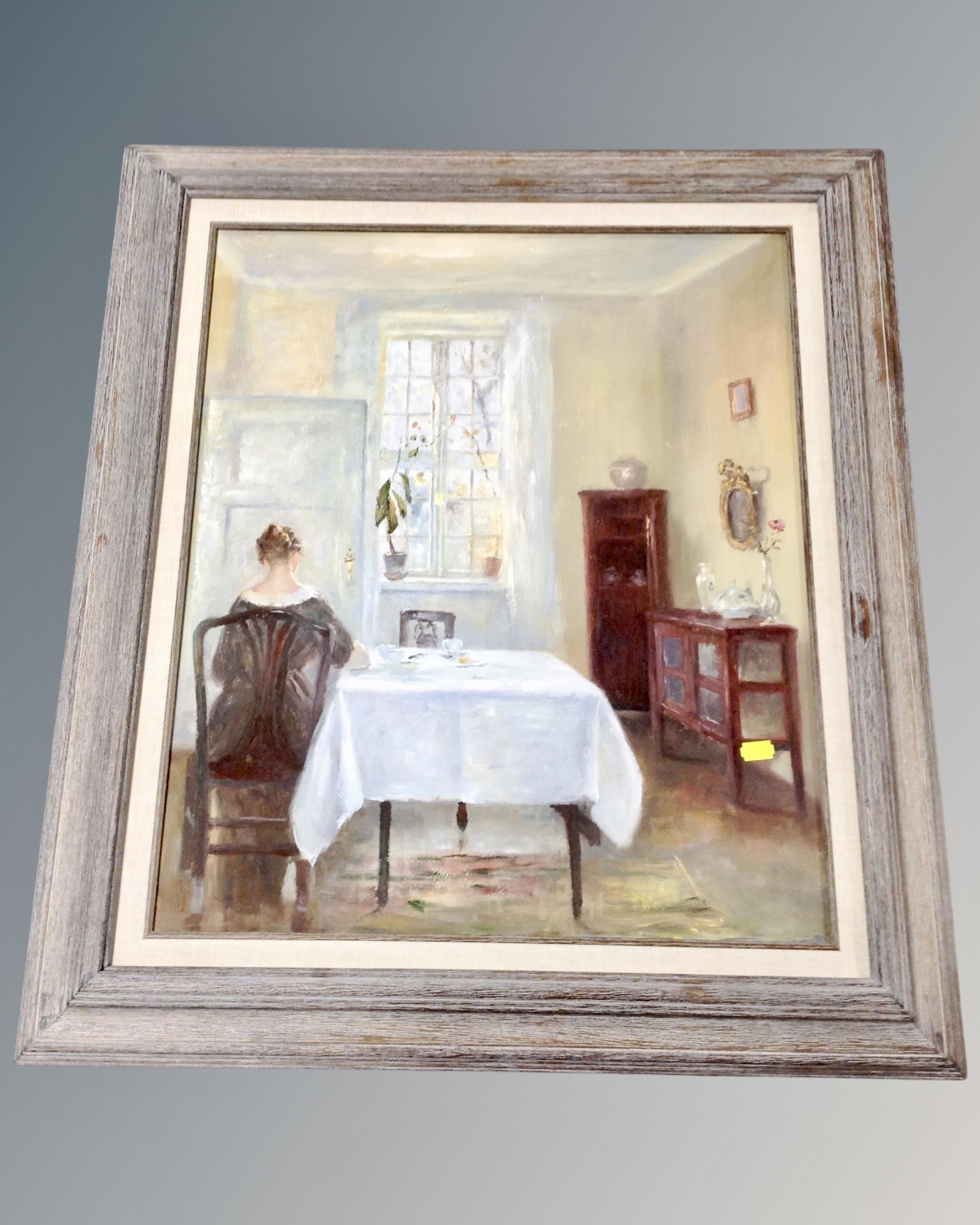 An oil on canvas depicting a lady seated in a dining room,