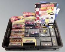 A crate containing a quantity of Championship Racing Bike magazines and die cast motorbikes in