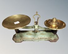 A set of 19th century Avery scales with graduated weights.