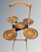 An Edwardian oak monoplane folding cake stand.