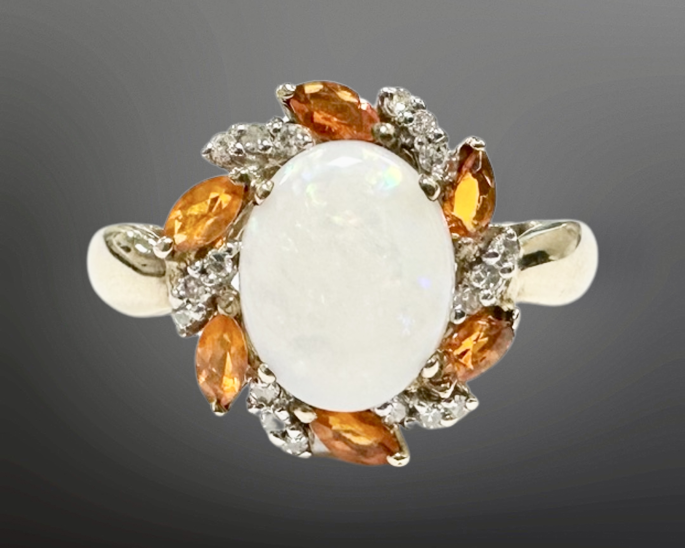 A 9ct gold opal and diamond cluster ring, size S, 3.1g.