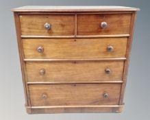 A Victorian mahogany two over three five drawer chest.