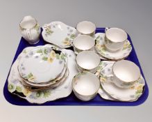 A twenty-one piece Roslyn china Marigold bone china tea service