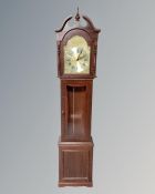 A Tempus Fugit longcase clock.