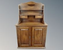 An oak double door buffet serving cabinet