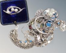 A boxed silver and pearl brooch, Swarovski metal chain and hoop pendant, a similar set,