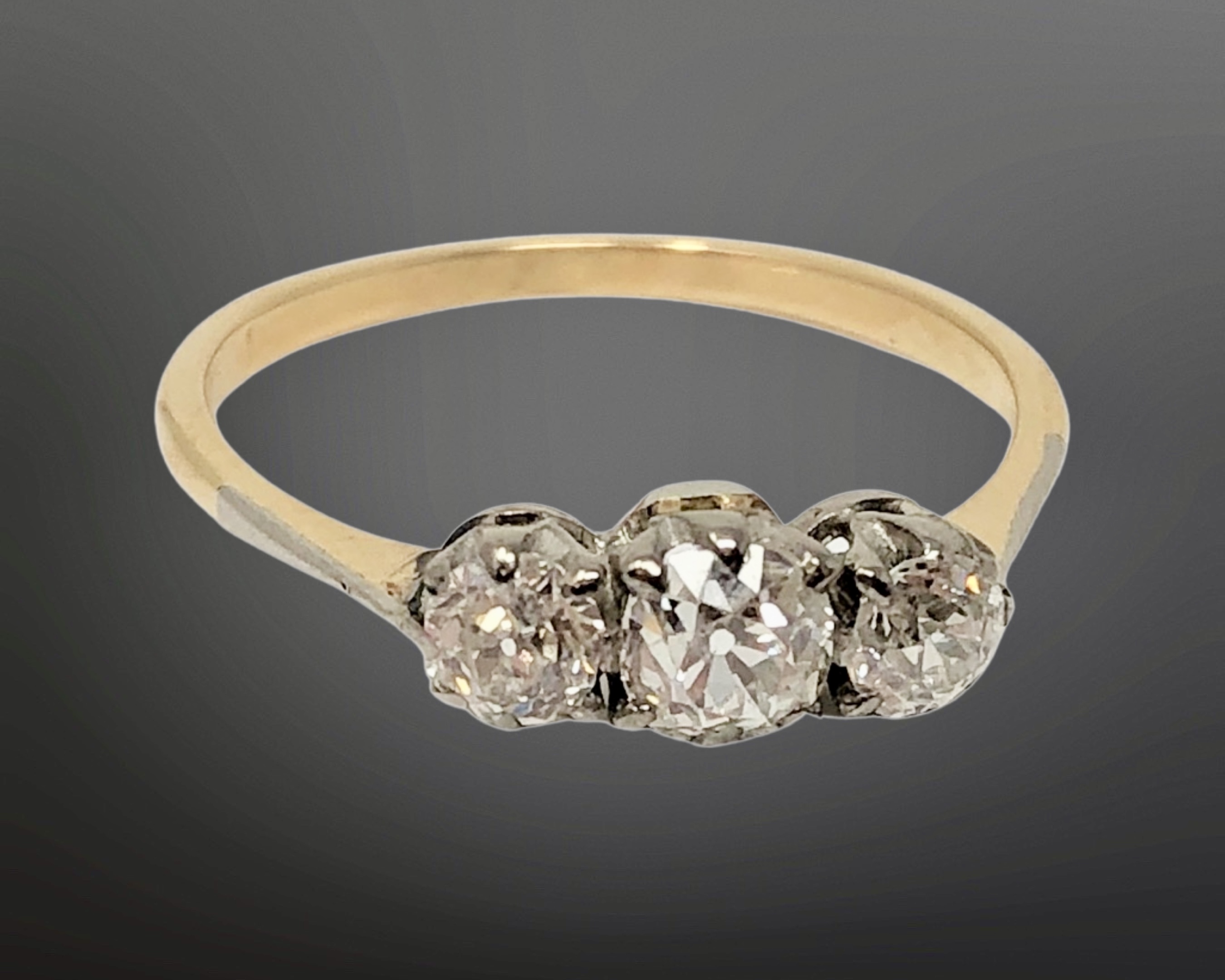 An antique 18ct gold three stone diamond ring, size O CONDITION REPORT: 1.