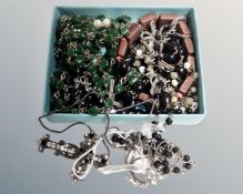 A small box of prayer beads and various pieces of religious ephemera