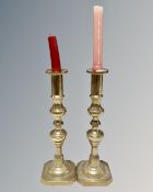 A pair of 19th century brass candlesticks.