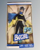 A Mattel Barbie Batgirl figure.