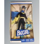 A Mattel Barbie Batgirl figure.