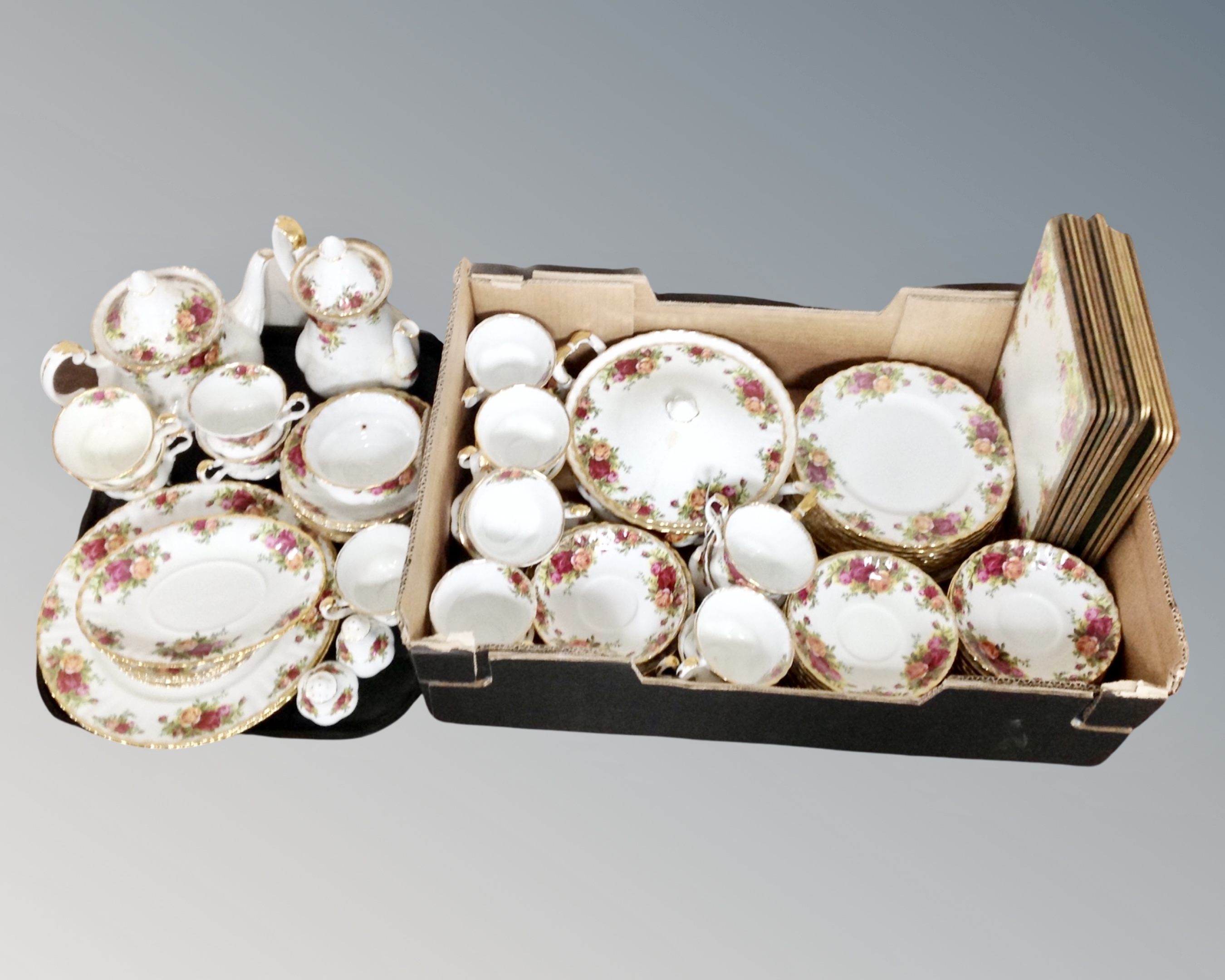 A box containing a quantity of Royal Albert Old Country Roses tea and dinner china together with