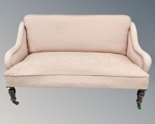 A Victorian two seater sofa.