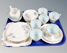 A tray of twenty-one pieces of Tuscan Blue Lily bone tea china