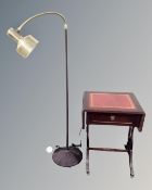 A 20th century angle poise floor lamp and a flap sided sofa table with a leather inset panel.