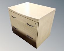 An office two drawer filing chest in a pine finish.