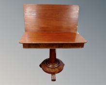 A Victorian mahogany pedestal turnover top tea table.