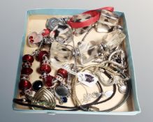 A tray of costume jewellery including Etnika, Skon, Freedom,