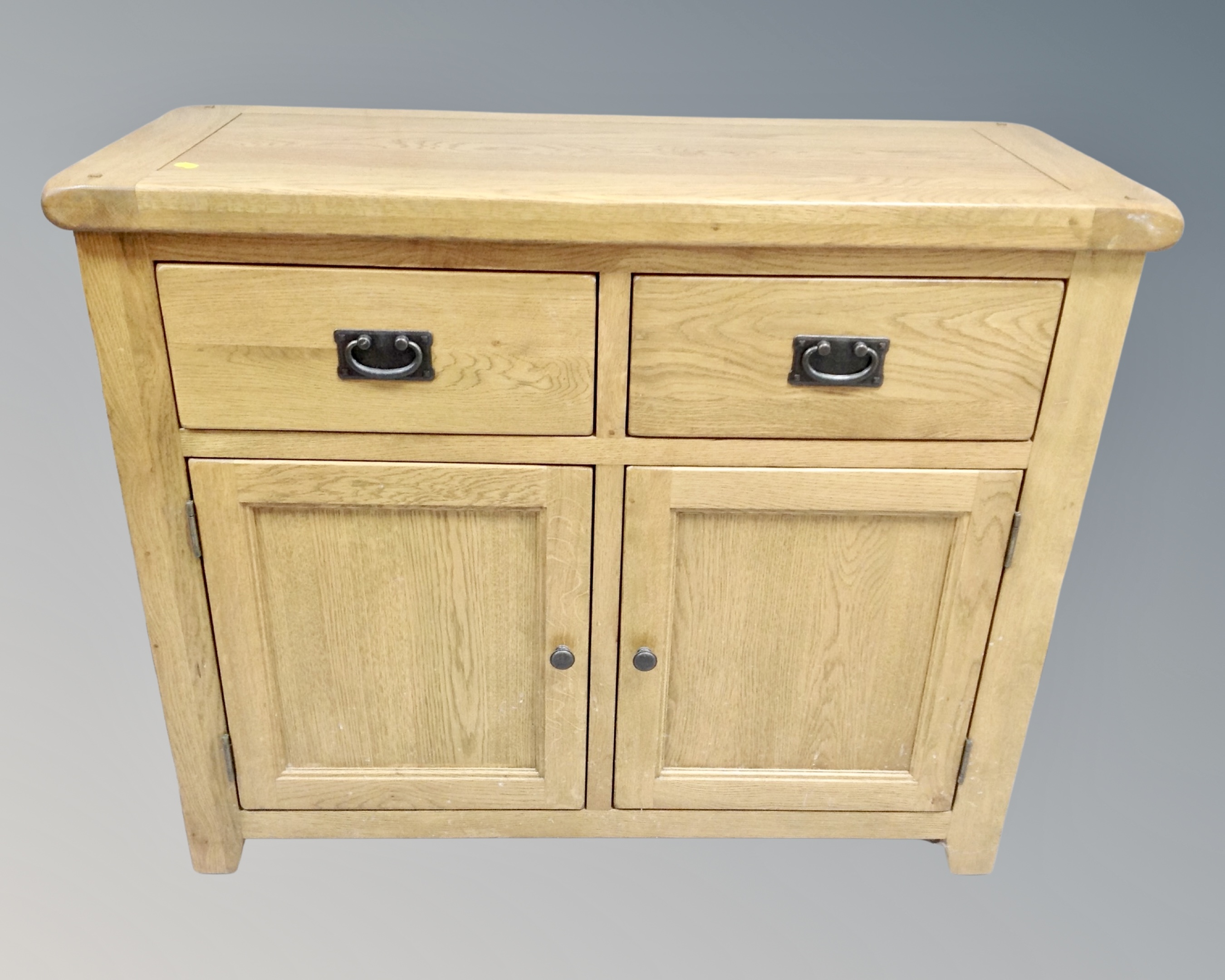 A Barker & Stonehouse contemporary oak double door sideboard fitted with two drawers above.