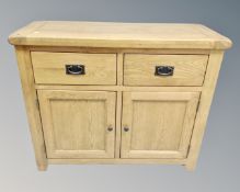 A Barker & Stonehouse contemporary oak double door sideboard fitted with two drawers above.