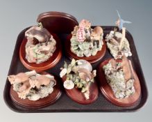 A tray of six Border Fine Arts animal figures on wooden stands (as found)