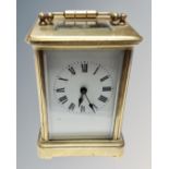A small heavy brass carriage clock
