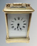 A small heavy brass carriage clock