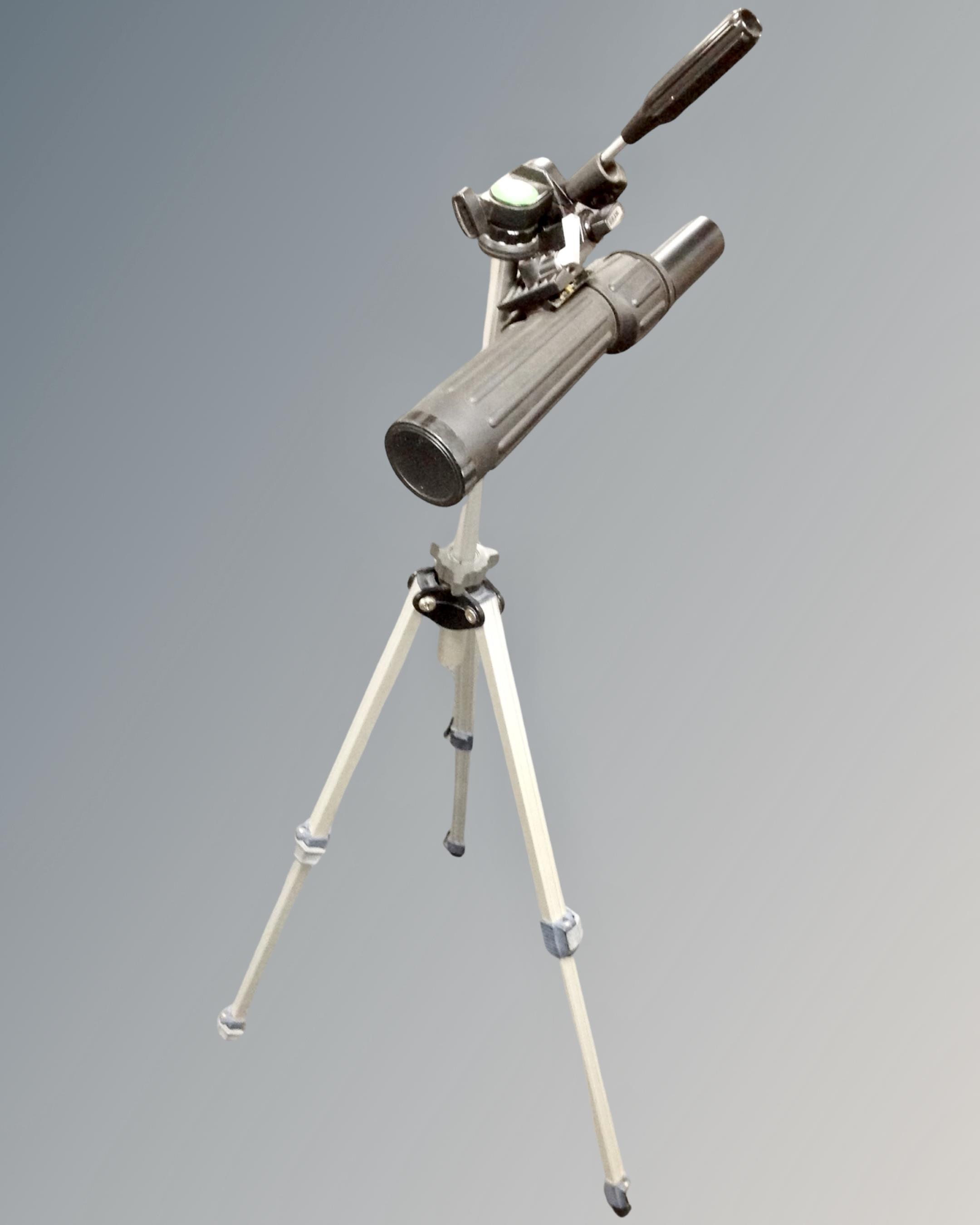 A Tasco 3711 spotting scope on tripod stand