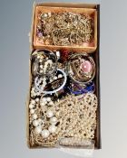 A tray of costume jewellery together with small tray of pearls, bangles,