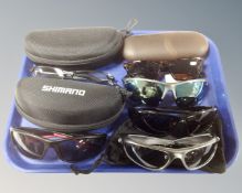 Six pairs of sunglasses including polarized Shimano etc.
