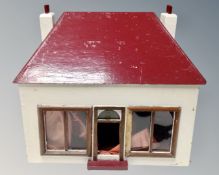 A mid century hand built wooden dolls house together with furniture
