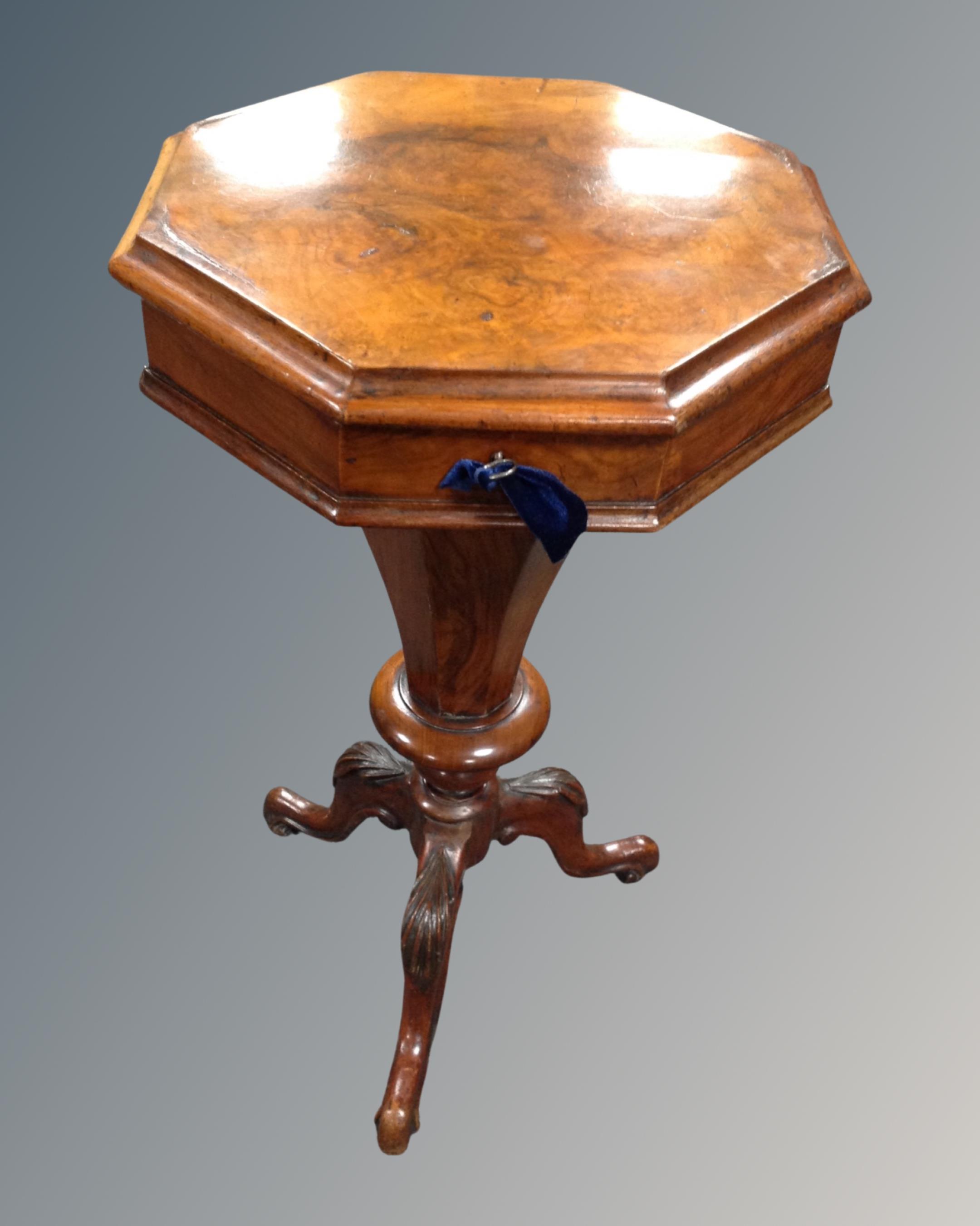 A Victorian mahogany trumpet shaped work table on three way pedestal.