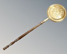 An antique brass beech handled bed warming pan