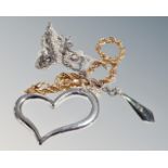 A large floating silver heart on silver chain,