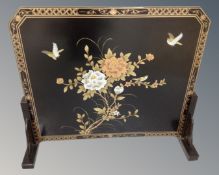 A contemporary Japanese style lacquered screen.