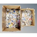 Two boxes of a large quantity of loose stamps