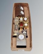 Seven miniature metal-cased desk clocks