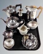 A tray of three piece Picquot ware tea service together with a four piece plated tea service and