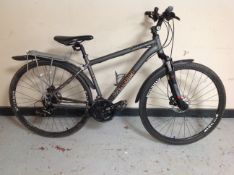 A Voodoo Marasa front suspension mountain bike with rear pannier.