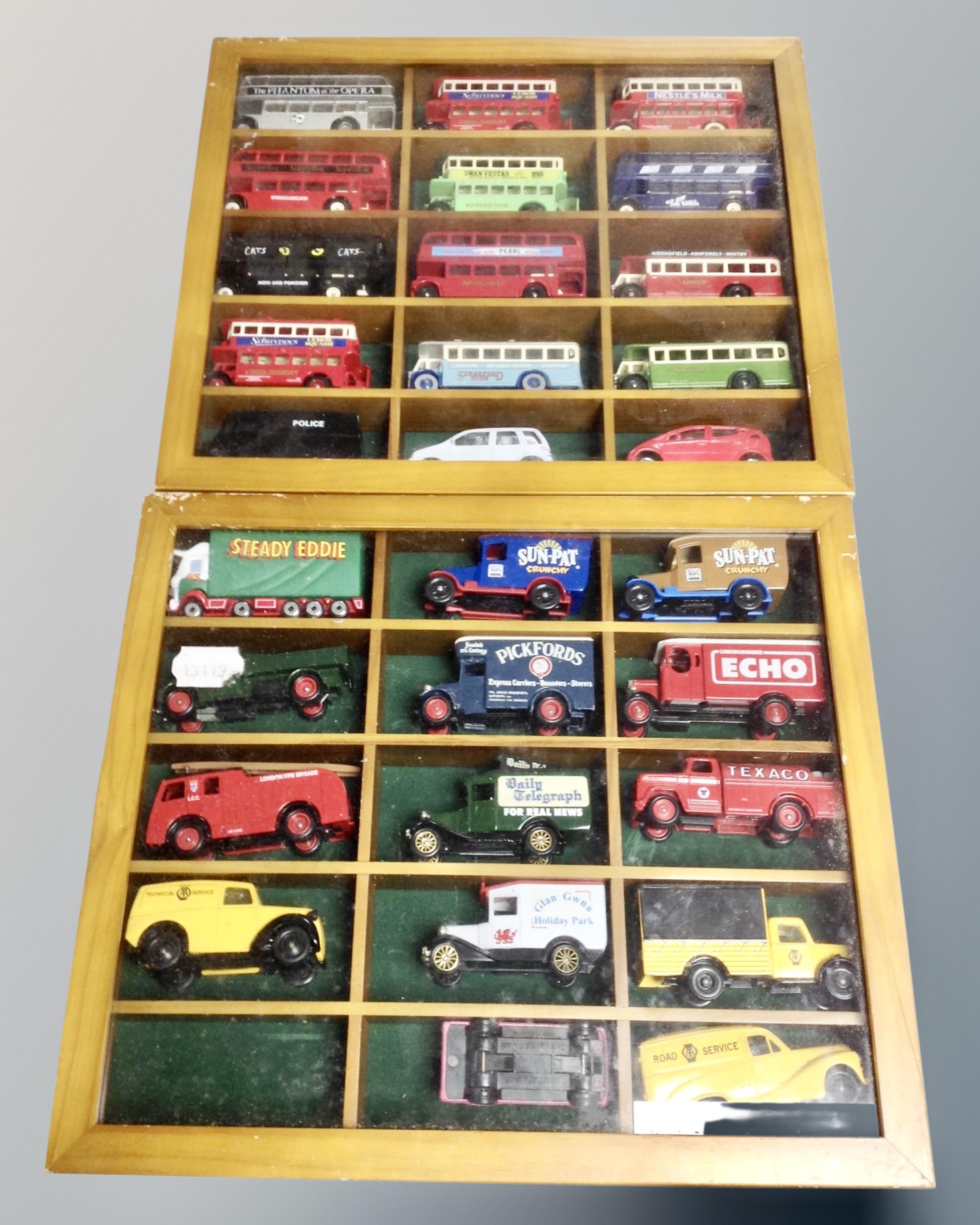 Two counter top display cases containing Days Gone and promotional die cast, buses,