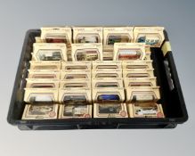 A crate containing Lledo die cast vehicles,